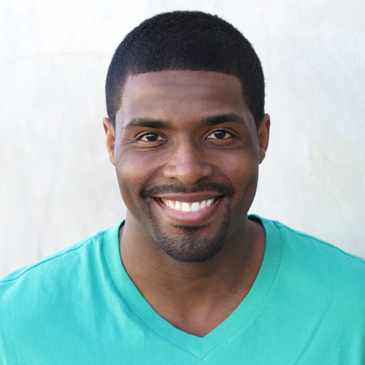 The image shows two elderly people, a man and a woman, smiling at the camera while posing for a photograph. They appear to be enjoying each other s company.