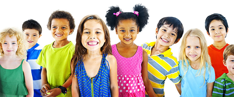 The image features a group of children standing together with smiles on their faces, showcasing a diverse range of skin tones and clothing styles.